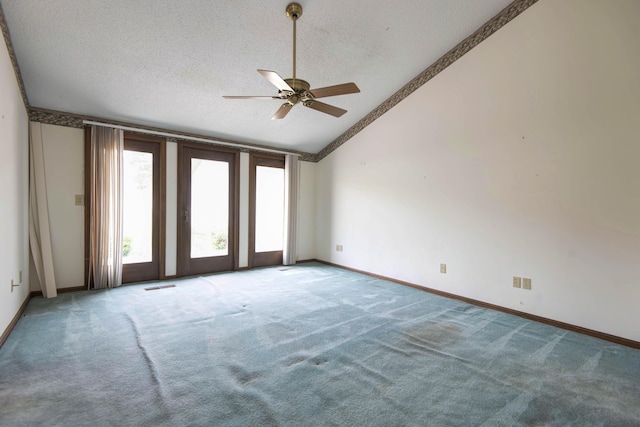 3501 E Cooper Blvd, Springfield, MO 65802 - empty room with vaulted ceiling, ceiling fan, a textured ceiling, and carpet