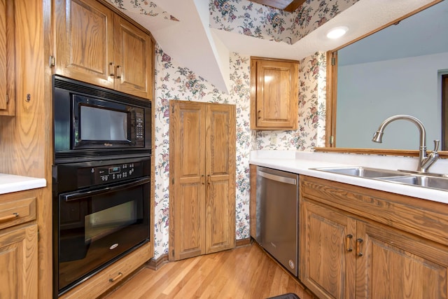 3501 E Cooper Blvd, Springfield, MO 65802 - kitchen featuring black appliances, wallpapered walls, light wood finished floors, light countertops, and brown cabinetry