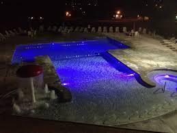 3501 E Cooper Blvd, Springfield, MO 65802 - pool at night featuring a patio area, a community pool, and a jacuzzi