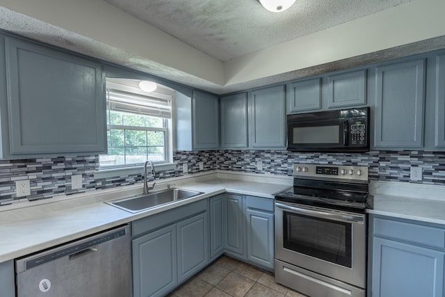2981 W Highpoint St, Springfield, MO 65810 - kitchen featuring appliances with stainless steel finishes, light tile patterned floors, a textured ceiling, tasteful backsplash, and light countertops