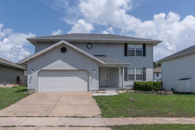 2981 W Highpoint St, Springfield, MO 65810 - view of front of home featuring an attached garage, a front yard, and concrete driveway