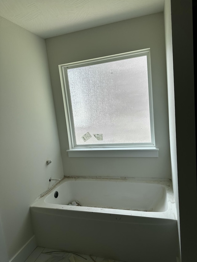 5569 E Wild Horse Dr, Springfield, MO 65802 - full bath with plenty of natural light and a garden tub