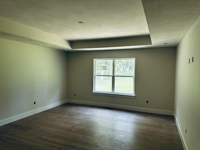 5569 E Wild Horse Dr, Springfield, MO 65802 - unfurnished room featuring dark wood-style floors and a textured ceiling