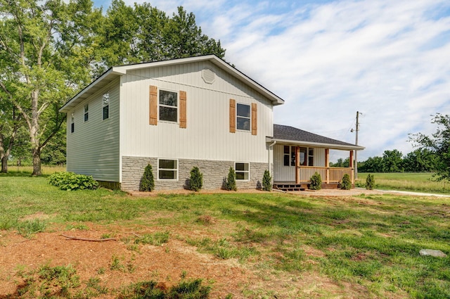 7208 N Farm Rd Unit 133, Springfield, MO 65803 - tri-level home with a front lawn and covered porch
