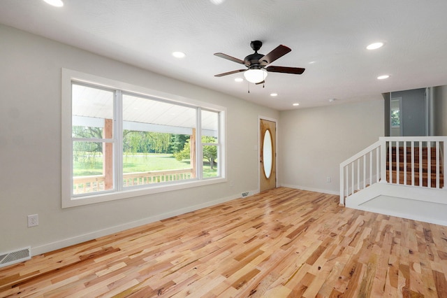 7208 N Farm Rd Unit 133, Springfield, MO 65803 - unfurnished room with healthy amount of natural light, recessed lighting, wood finished floors, and ceiling fan