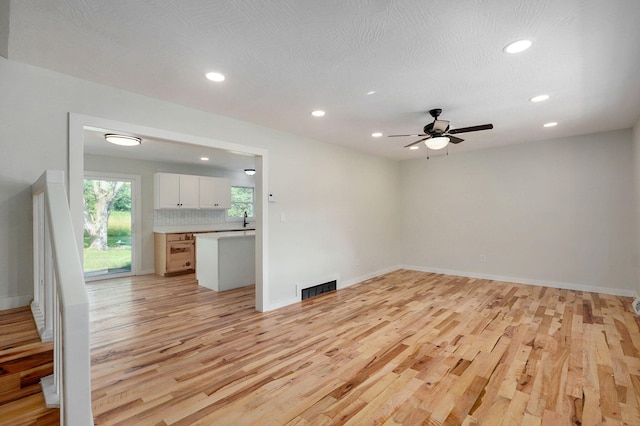 7208 N Farm Rd Unit 133, Springfield, MO 65803 - unfurnished living room with light wood-type flooring, recessed lighting, and ceiling fan