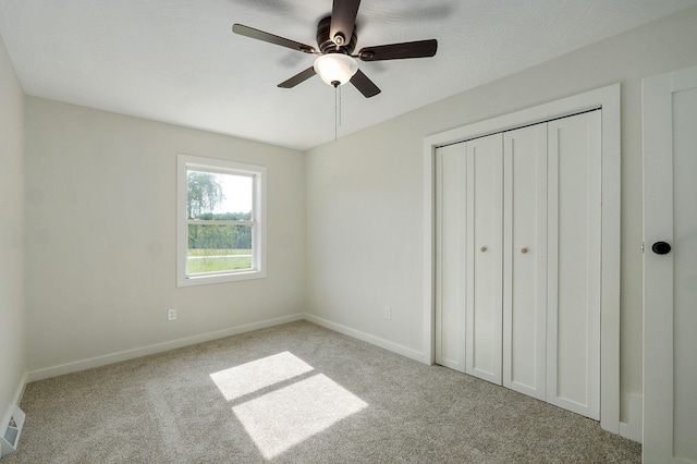 7208 N Farm Rd Unit 133, Springfield, MO 65803 - unfurnished bedroom featuring carpet flooring, a closet, and ceiling fan