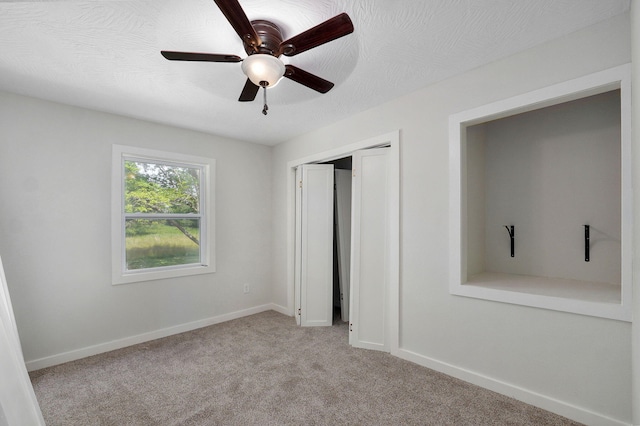 7208 N Farm Rd Unit 133, Springfield, MO 65803 - unfurnished bedroom with carpet flooring, a closet, and a ceiling fan