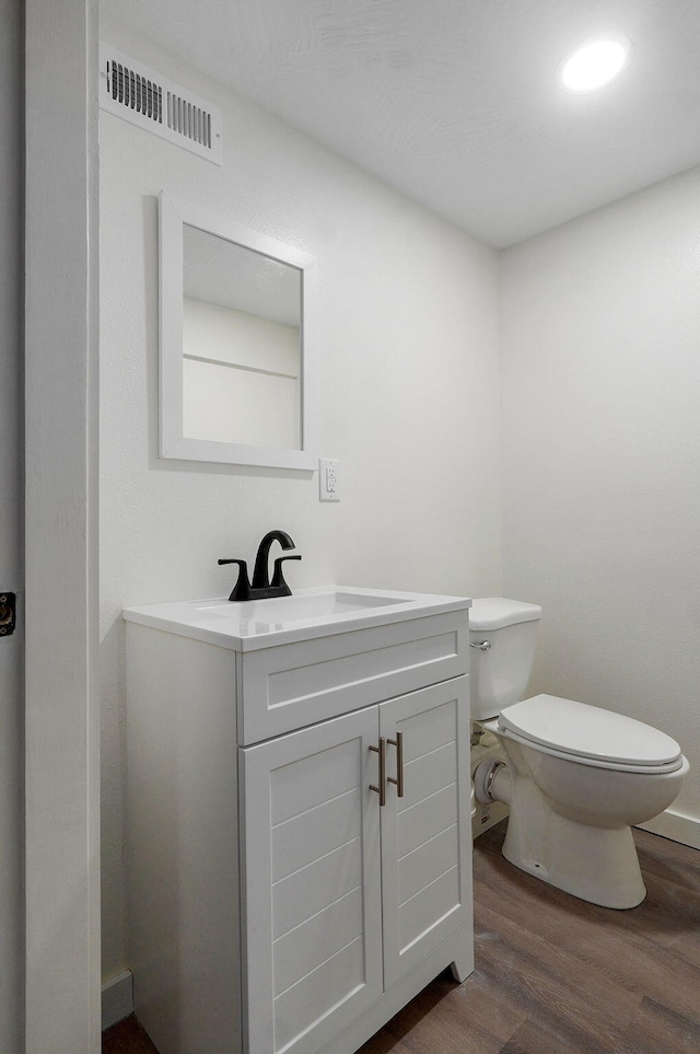 7208 N Farm Rd Unit 133, Springfield, MO 65803 - half bathroom with wood finished floors and vanity