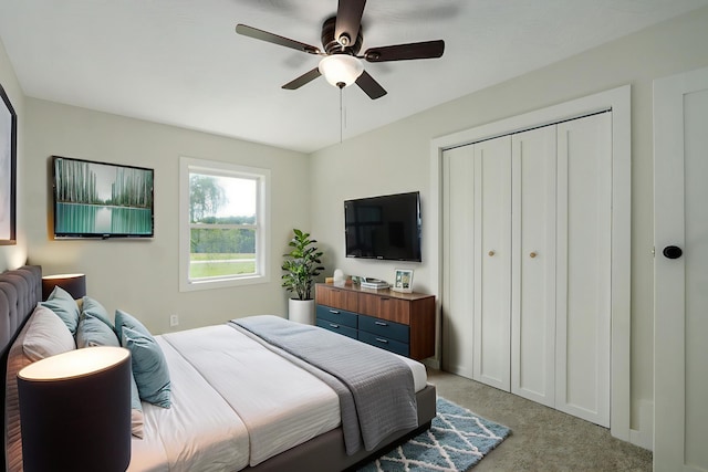 7208 N Farm Rd Unit 133, Springfield, MO 65803 - bedroom with light carpet, a closet, and ceiling fan