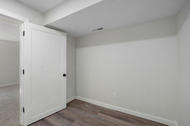 7208 N Farm Rd Unit 133, Springfield, MO 65803 - unfurnished bedroom featuring dark wood-type flooring and a closet