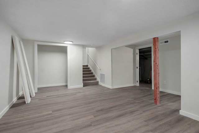 7208 N Farm Rd Unit 133, Springfield, MO 65803 - finished below grade area featuring wood finished floors and stairway