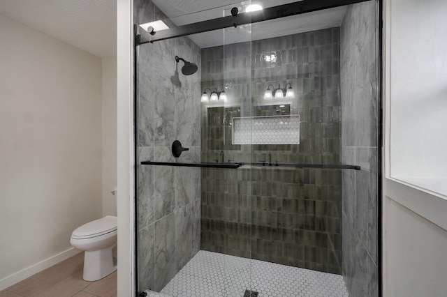 7208 N Farm Rd Unit 133, Springfield, MO 65803 - bathroom featuring toilet and a stall shower