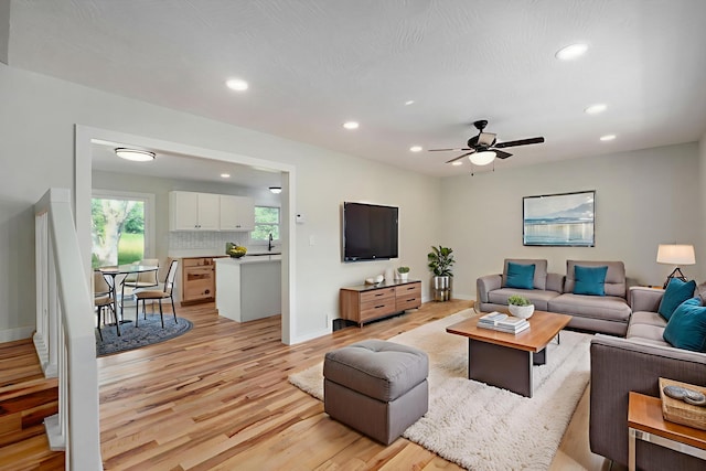7208 N Farm Rd Unit 133, Springfield, MO 65803 - living area featuring light wood-style flooring, recessed lighting, and a ceiling fan