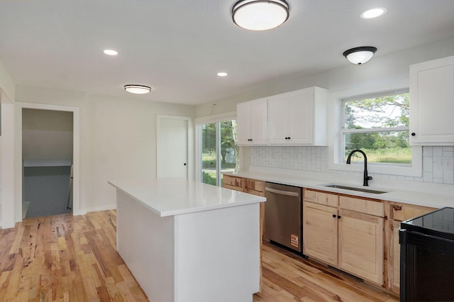 7208 N Farm Rd Unit 133, Springfield, MO 65803 - kitchen featuring dishwasher, decorative backsplash, light countertops, light wood-type flooring, and recessed lighting