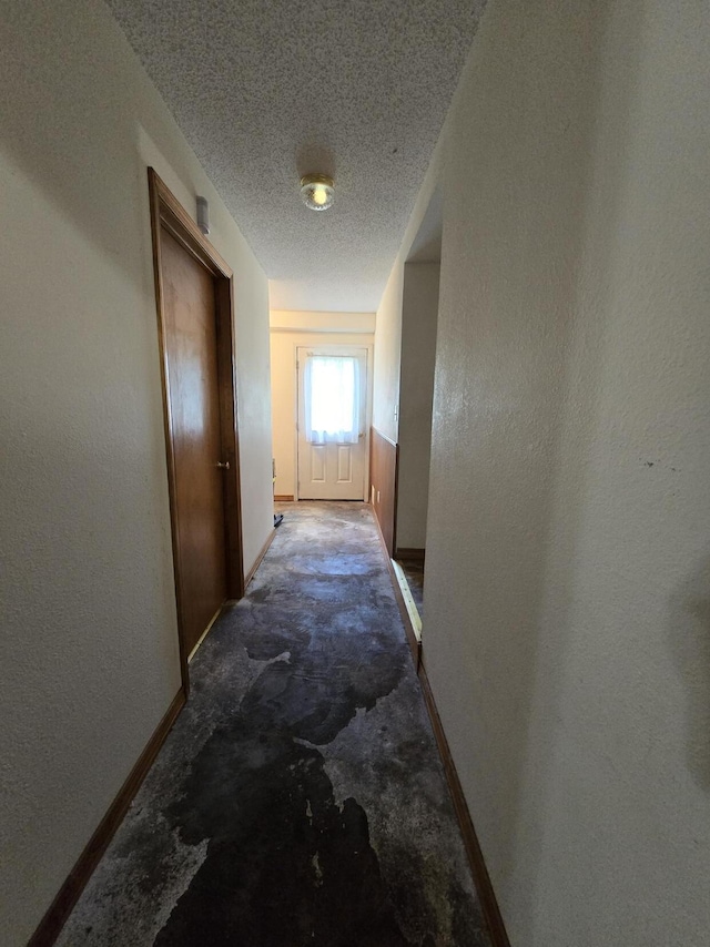 445 Monroe St, Thayer, MO 65791 - hallway with baseboards and a textured ceiling