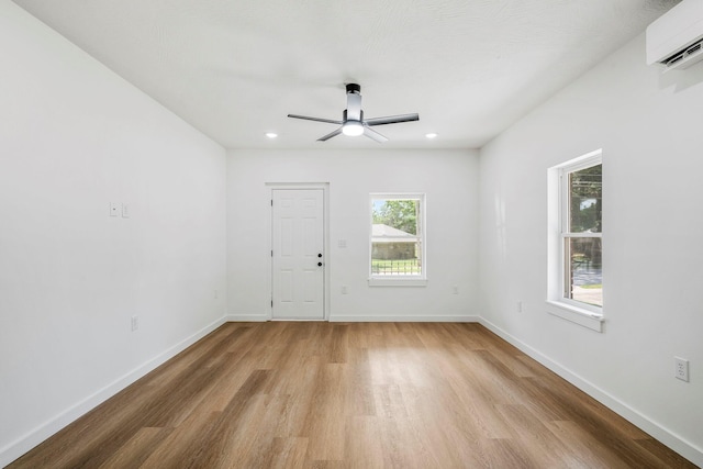 934 S New Ave, Springfield, MO 65806 - spare room featuring an AC wall unit, light wood finished floors, ceiling fan, and recessed lighting