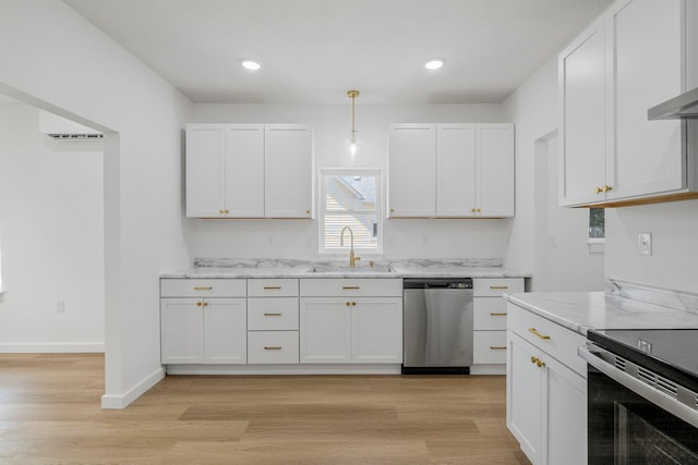 934 S New Ave, Springfield, MO 65806 - kitchen featuring stainless steel appliances, white cabinets, light stone countertops, light wood finished floors, and recessed lighting