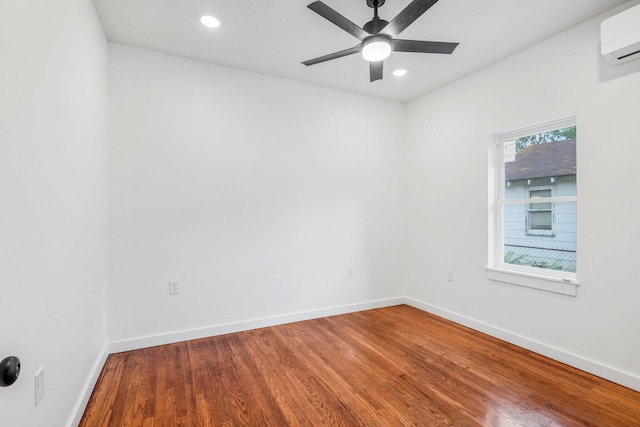 934 S New Ave, Springfield, MO 65806 - spare room with an AC wall unit, wood finished floors, ceiling fan, and recessed lighting