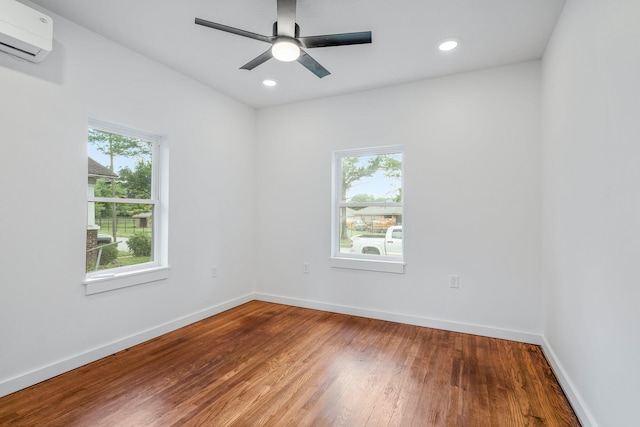 934 S New Ave, Springfield, MO 65806 - empty room featuring a wall unit AC, wood finished floors, recessed lighting, and ceiling fan