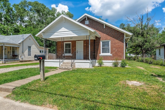 934 S New Ave, Springfield, MO 65806 - bungalow-style house featuring covered porch, brick siding, concrete driveway, and an attached carport