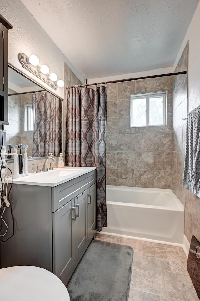 1908 Hazel St, Carthage, MO 64836 - full bath featuring shower / bath combo, vanity, and a textured ceiling
