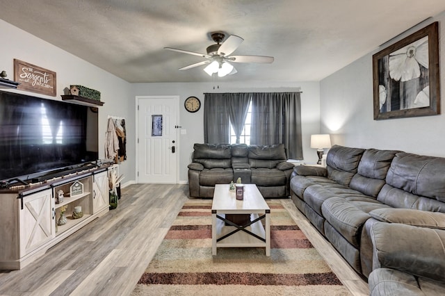 1908 Hazel St, Carthage, MO 64836 - living area with ceiling fan and light wood finished floors