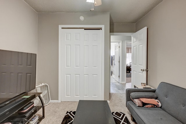 1908 Hazel St, Carthage, MO 64836 - workout area featuring a textured ceiling and carpet floors
