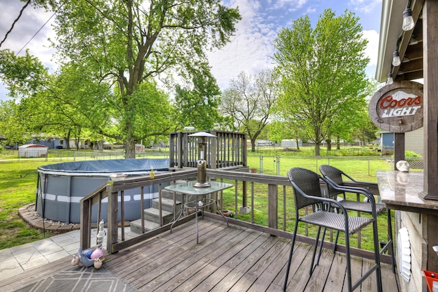 1908 Hazel St, Carthage, MO 64836 - deck featuring a covered pool and a fenced backyard