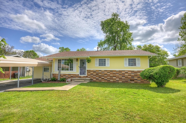 1908 Hazel St, Carthage, MO 64836 - ranch-style house featuring a detached carport, a front lawn, and brick siding