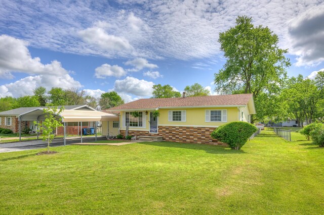 1908 Hazel St, Carthage, MO 64836 - single story home with a carport, brick siding, and driveway