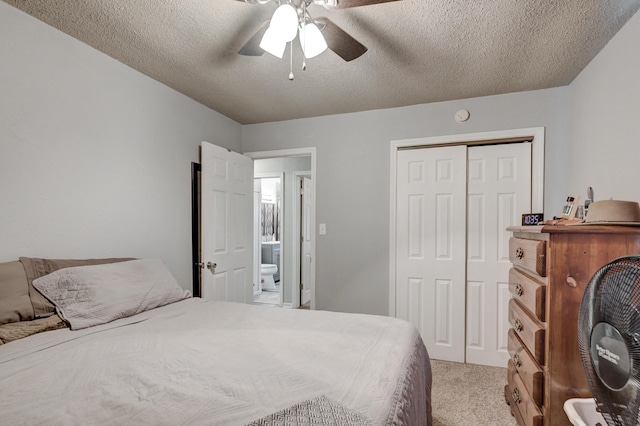 1908 Hazel St, Carthage, MO 64836 - bedroom with light colored carpet, a closet, ceiling fan, and a textured ceiling