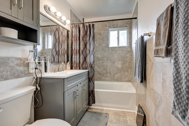 1908 Hazel St, Carthage, MO 64836 - bathroom featuring vanity, tile walls, and shower / tub combo with curtain