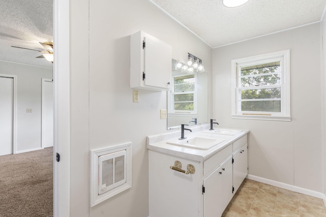 595 Johns Ford Rd, Sparta, MO 65753 - bathroom with a textured ceiling, double vanity, ornamental molding, a ceiling fan, and heating unit