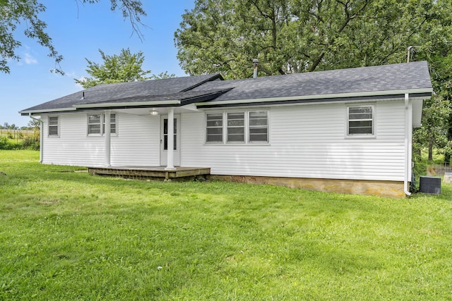 595 Johns Ford Rd, Sparta, MO 65753 - back of house with a yard and roof with shingles