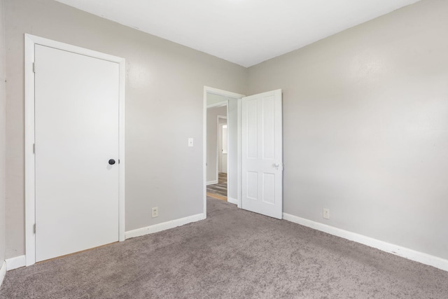 595 Johns Ford Rd, Sparta, MO 65753 - unfurnished bedroom with carpet and baseboards