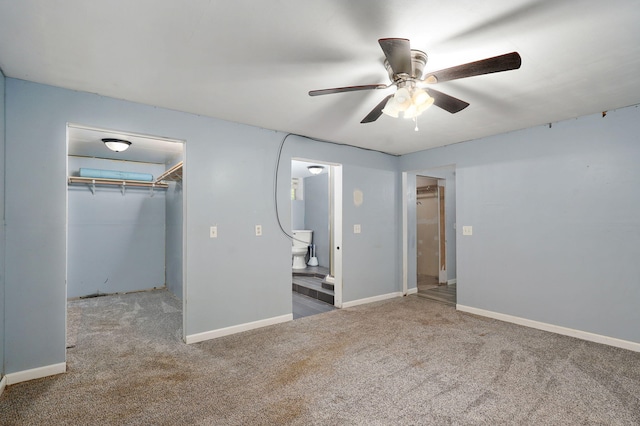 1311 S 9th St, Ozark, MO 65721 - unfurnished bedroom with carpet floors, a walk in closet, a closet, and ceiling fan