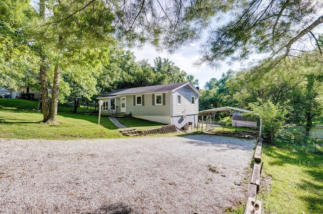1311 S 9th St, Ozark, MO 65721 - view of front facade featuring gravel driveway and a detached carport