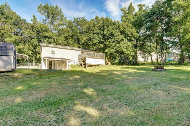 1311 S 9th St, Ozark, MO 65721 - view of yard featuring a wooden deck, an outdoor fire pit, and a carport