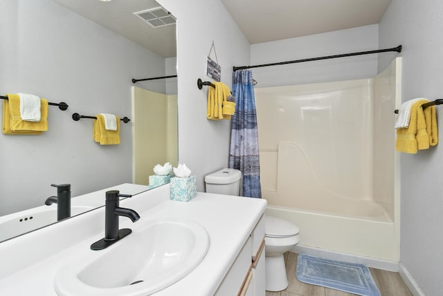 123 Bunker Ridge Dr Unit 7, Branson, MO 65616 - full bathroom with vanity, shower / bath combo with shower curtain, and wood finished floors