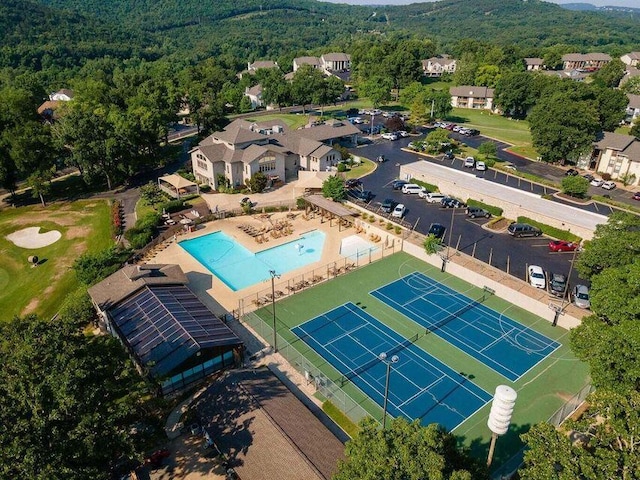 123 Bunker Ridge Dr Unit 7, Branson, MO 65616 - bird's eye view of a pool area and a forest