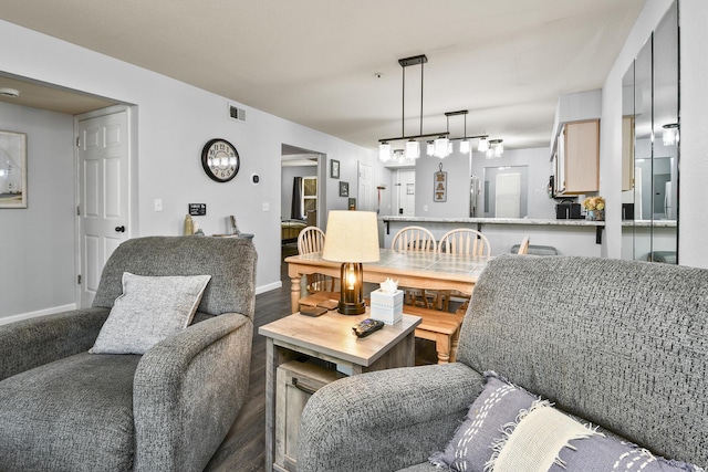 123 Bunker Ridge Dr Unit 7, Branson, MO 65616 - living room with baseboards and wood finished floors