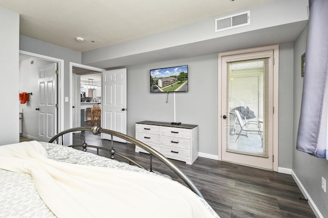 123 Bunker Ridge Dr Unit 7, Branson, MO 65616 - bedroom with dark wood-style flooring and baseboards
