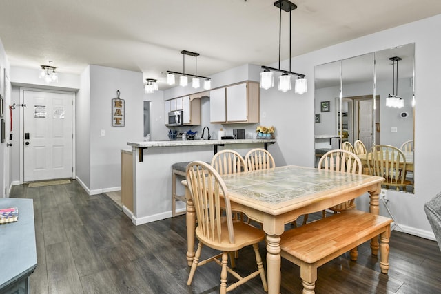 123 Bunker Ridge Dr Unit 7, Branson, MO 65616 - dining room featuring dark wood-style floors and baseboards