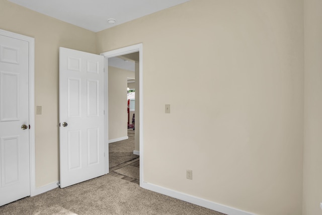 707 N College Ave, Republic, MO 65738 - unfurnished bedroom featuring light carpet and baseboards