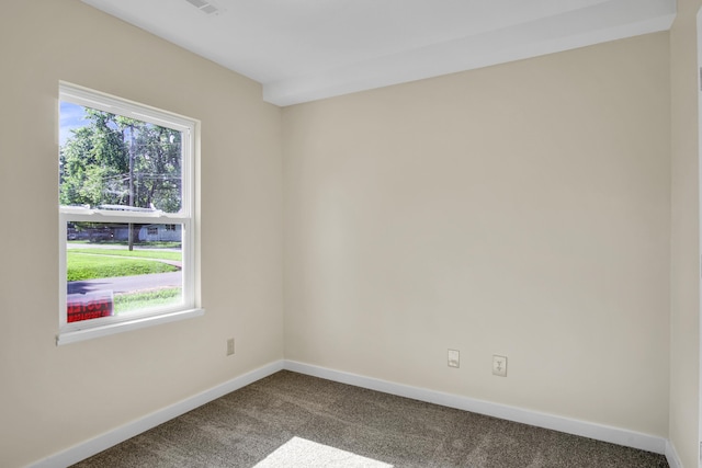 707 N College Ave, Republic, MO 65738 - empty room featuring dark carpet and healthy amount of natural light