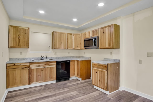 707 N College Ave, Republic, MO 65738 - kitchen with dishwasher, stainless steel microwave, a raised ceiling, light wood-style flooring, and recessed lighting