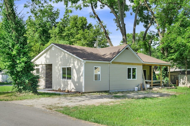 707 N College Ave, Republic, MO 65738 - view of front of home featuring a front lawn and roof with shingles