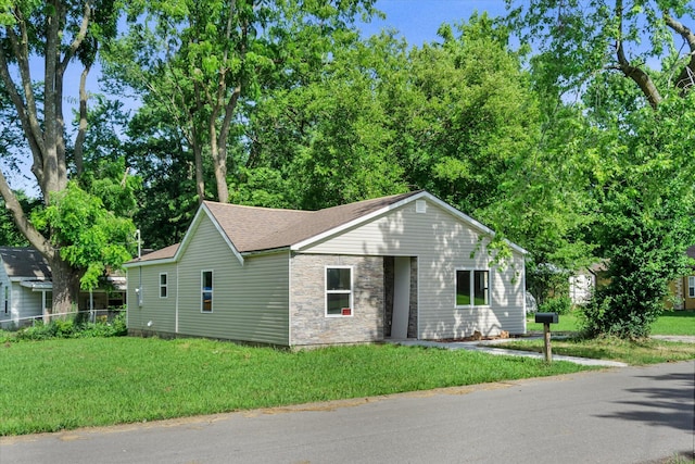 707 N College Ave, Republic, MO 65738 - view of front of property with a front lawn, stone siding, and a shingled roof