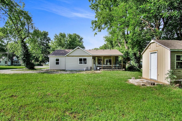 707 N College Ave, Republic, MO 65738 - rear view of property featuring a lawn and a shed